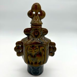 Asian style animal motif ceramic vessel with topper.